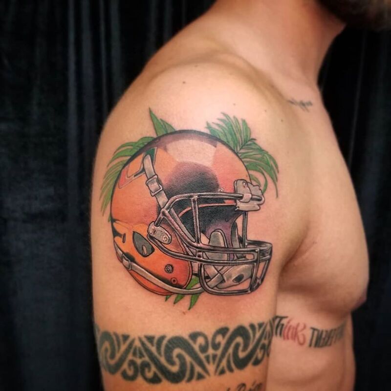 Football helmet tattoo done at Overlord Tattoo Studio Miami Beach