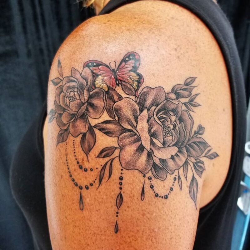 Butterfly roses tattoo done at Overlord Tattoo Studio Miami Beach