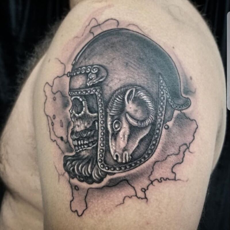 Medieval helmet skull tattoo done at Overlord Tattoo Studio Miami Beach